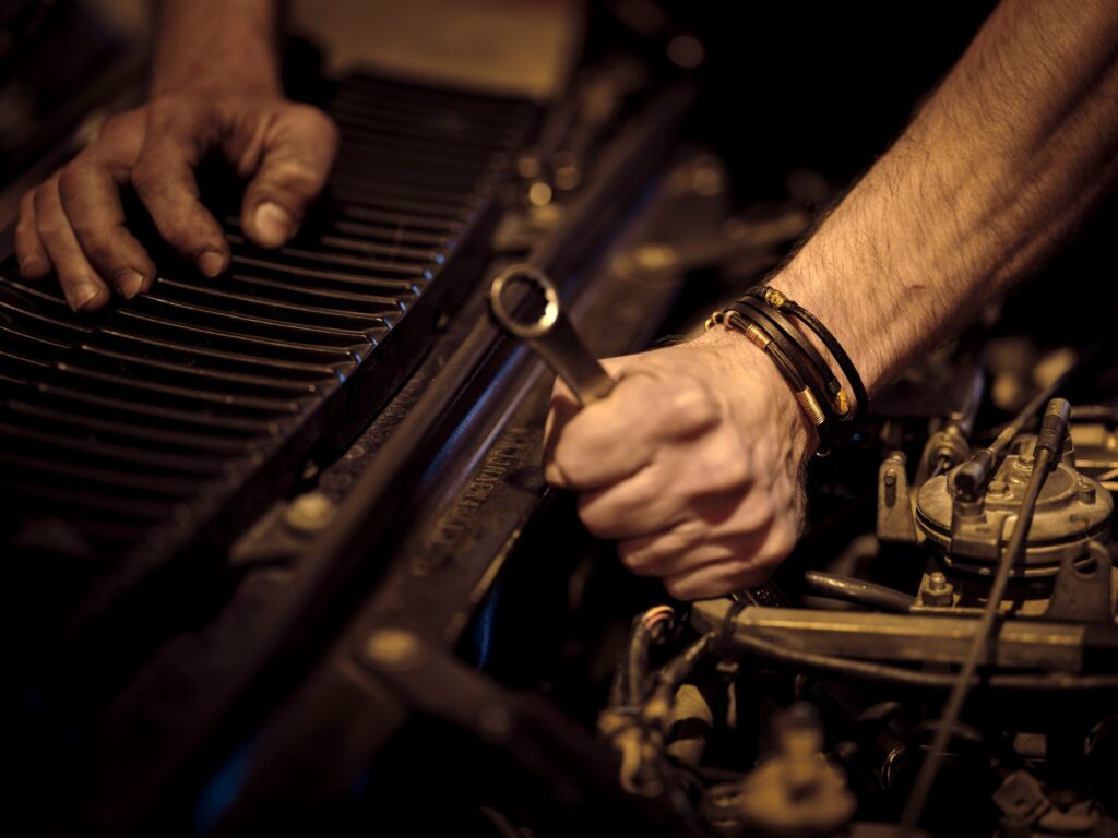a man is fixing a car